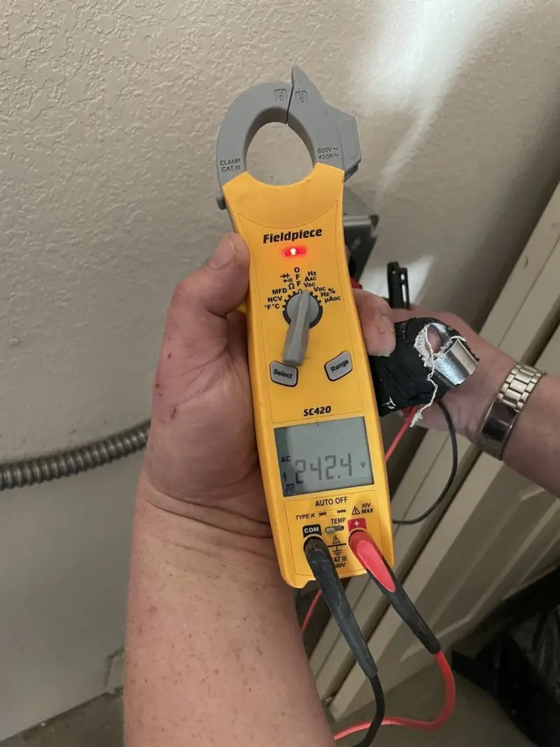 Voltage testing with clamp meter during Electrical Installation Services in Marion